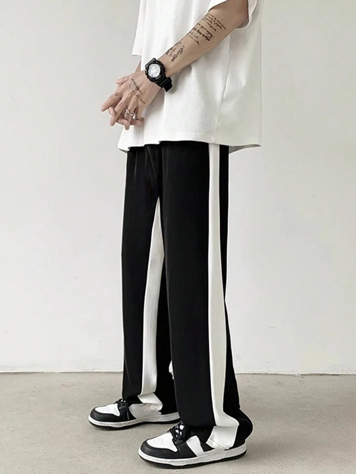 Black straight fit track pants with side stripes, premium all-season fabric by BombyyClothing