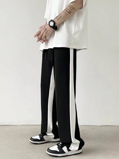 Black straight fit track pants with side stripes, premium all-season fabric by BombyyClothing
