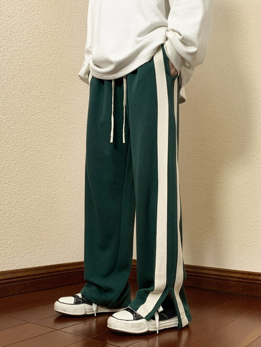 Green straight fit track pants with white side stripes, premium all-season fabric by BombyyClothing