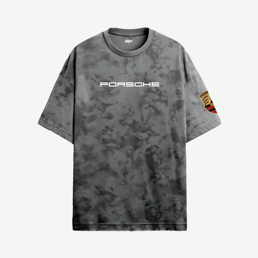 Black Porsche acid wash bomber jacket with stitched branding and premium racing-inspired craftsmanship.