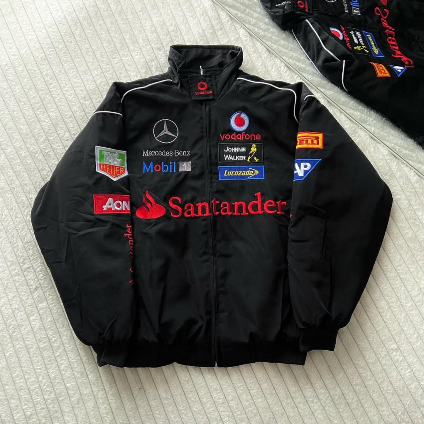 Santander Mercedes AMG embroidered bomber jacket featuring lightweight parachute fabric and Formula One inspired look.