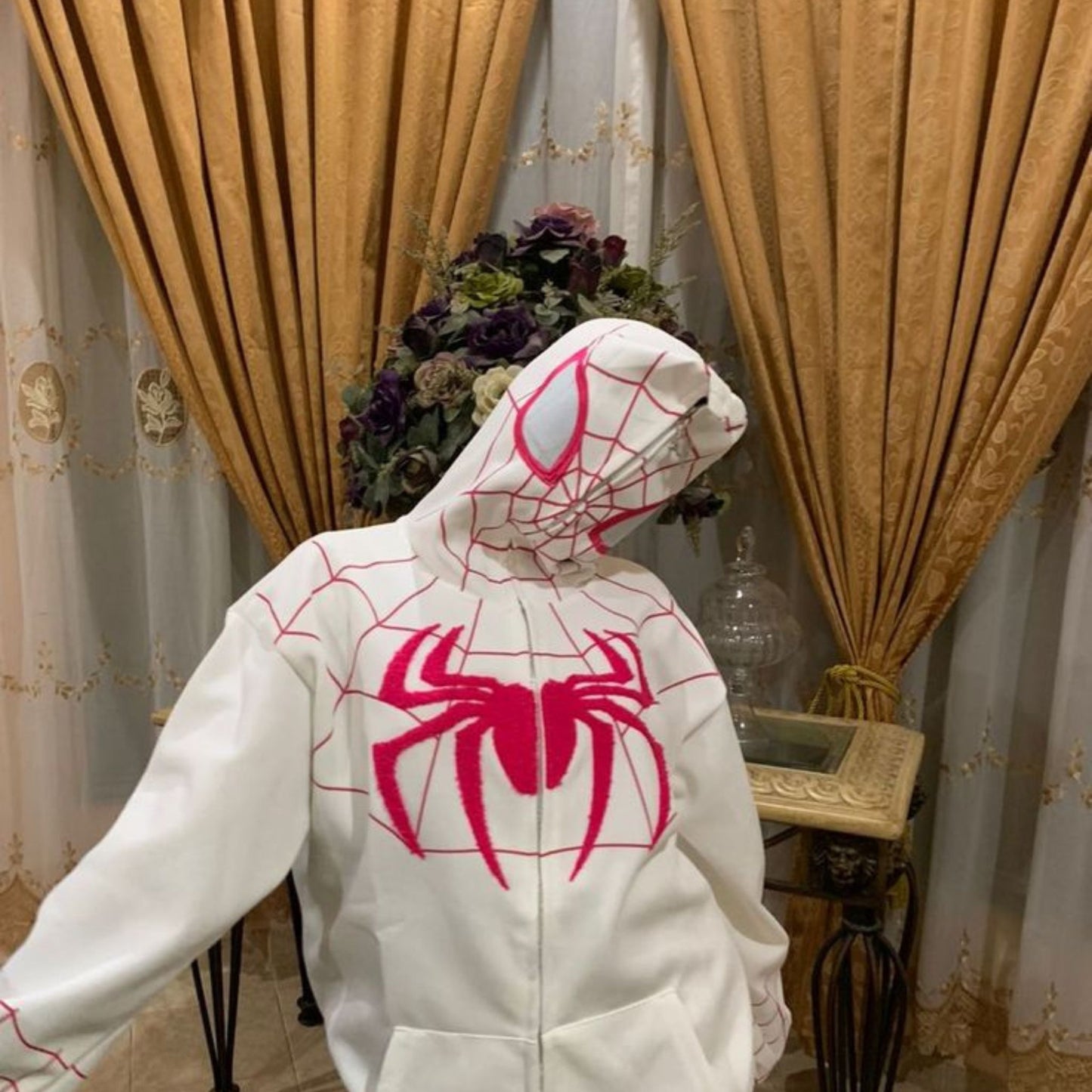 Unisex Spider-Man web hoodie featuring classic red and blue design, perfect for streetwear